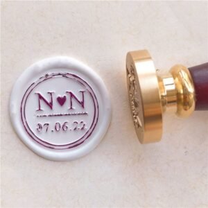 Personalised wax seal featuring initials, a heart and a date